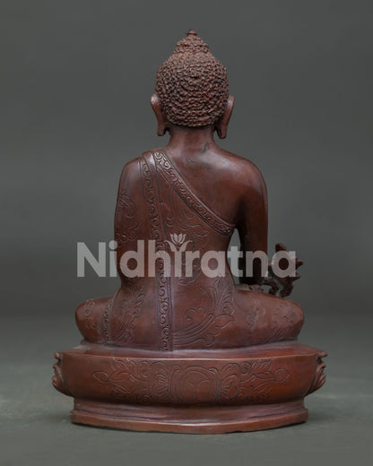 Medicine Buddha Statue handcrafted by Newari artisans from Patan Nepal with oxidized copper finish.