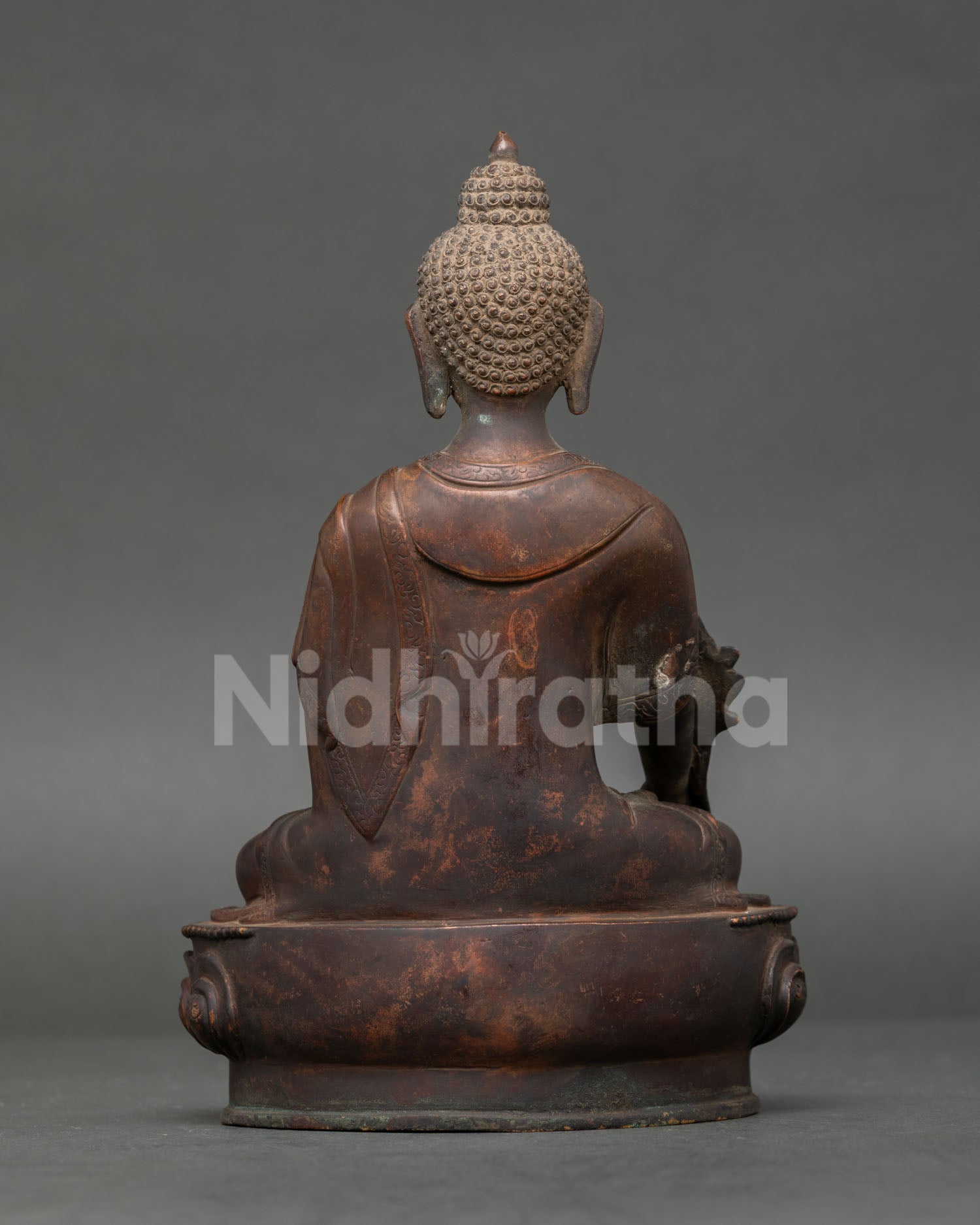 Medicine Buddha statue handcrafted by Newari artisans in Patan Nepal with antique oxidized finish.