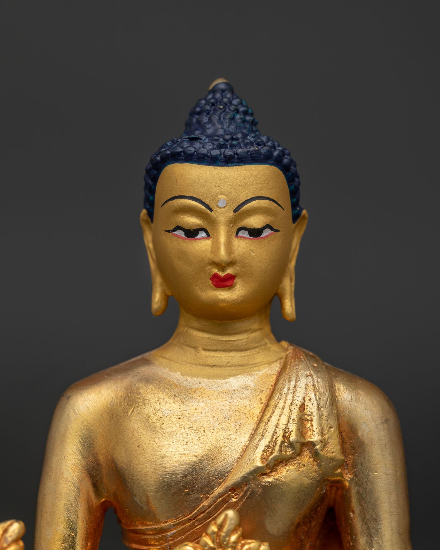 Medicine Buddha statue regular close up showing gold gilded details and Newari craftsmanship.