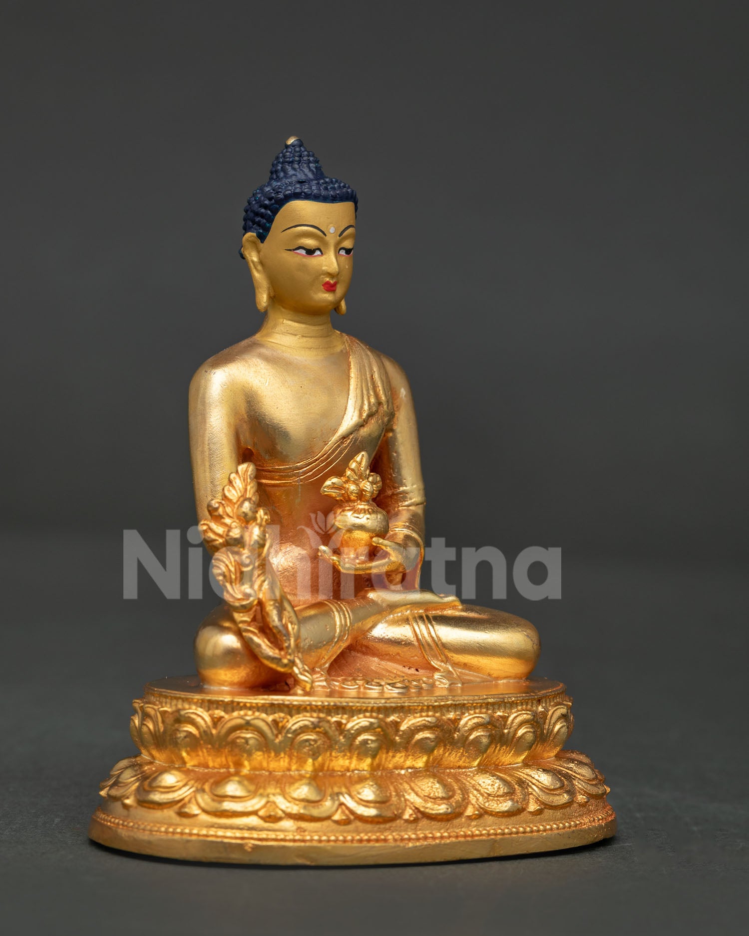 Medicine Buddha statue right view side showing healing nectar bowl and lotus pedestal.