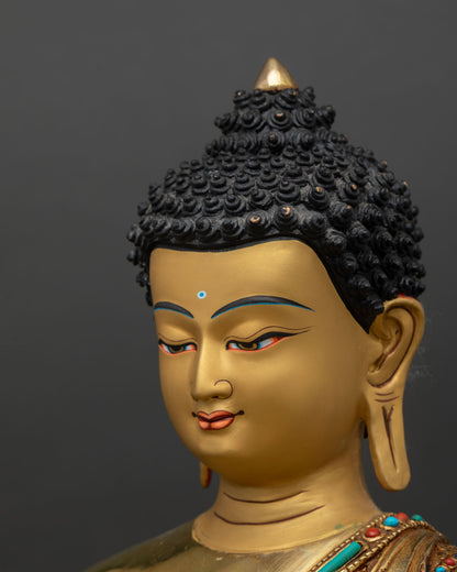 Medicine Buddha statue side face close up, serene Medicine Buddha expression with gold painted facial detailing Nepal art