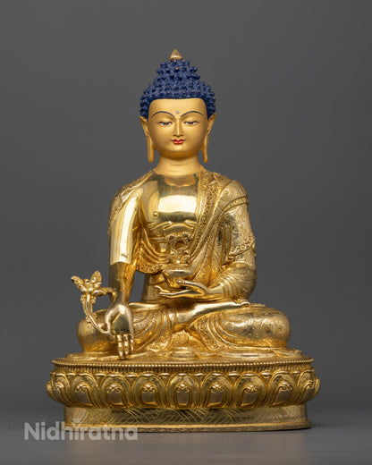 Medicine Buddha statue with gold fire gilded copper finish.