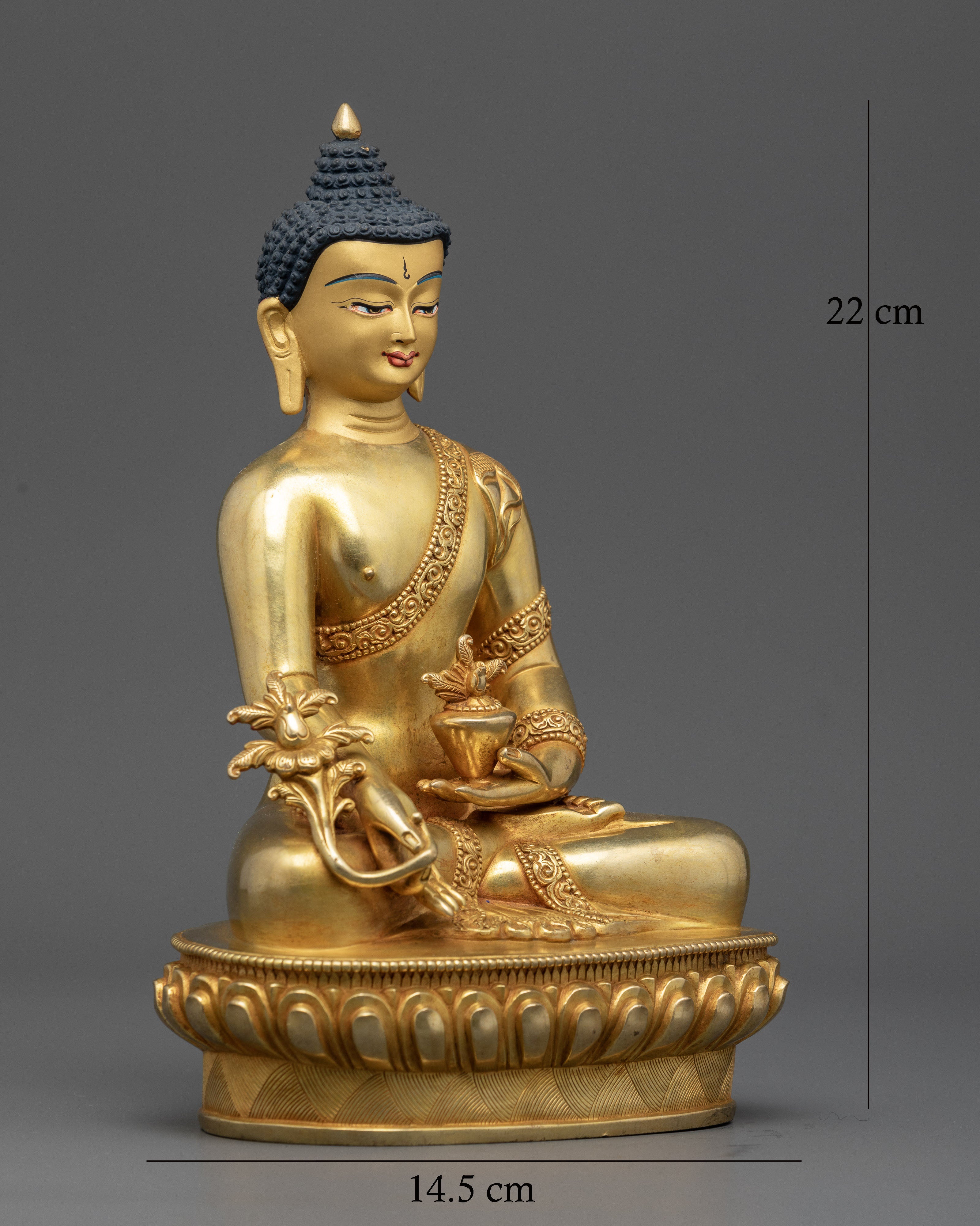 Medicine buddha statue with gold painted face and hand-carved monk robe.