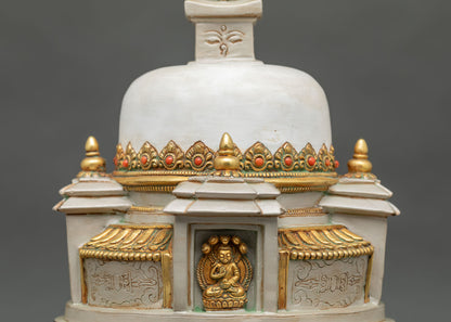 Meditating Buddha carved in a niche of a hand-painted Nepali stupa with semi-precious adornments