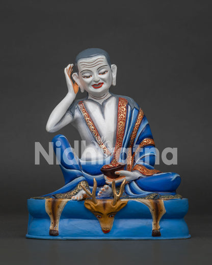 Milarepa statue, front view of handcrafted copper yogi with raised ear gesture and skull cup