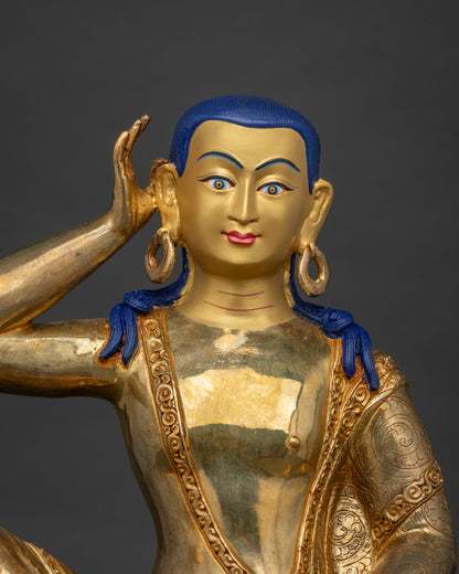 Milarepa statue seated on engraved deer skin pedestal with listening gesture