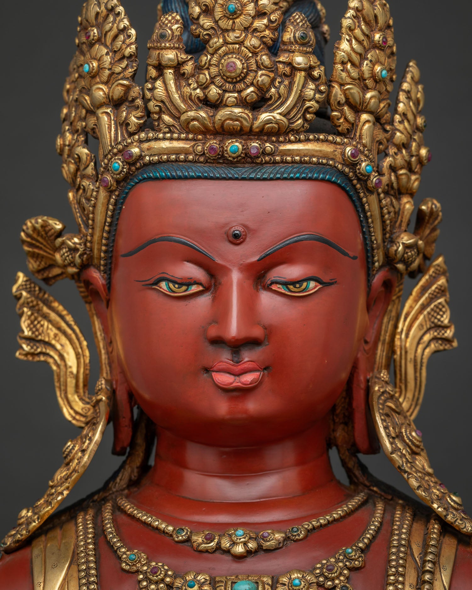 Mitrugpa Buddha detailed face close up showing serene expression and hand painted features