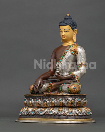 Mitrugpa Buddha statue oxidized copper gold silver plated detailing.