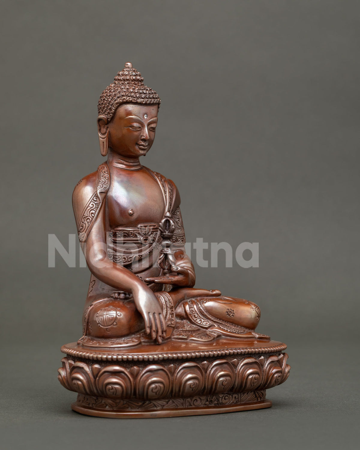 Mitrugpa seated on hand carved lotus pedestal in bhumisparsha mudra holding vajra.