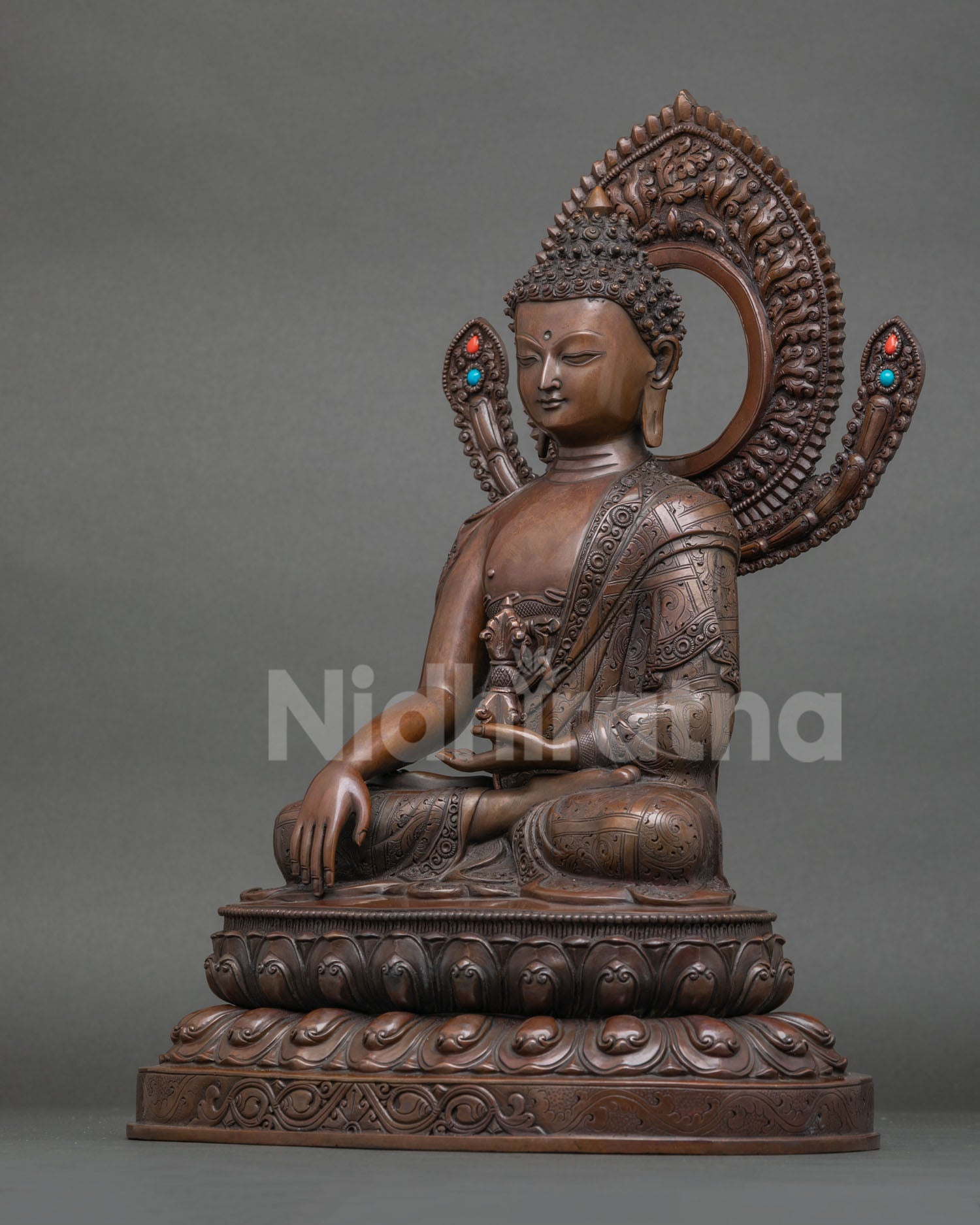 Mitrugpa statue with ornate halo and semi precious stone inlays