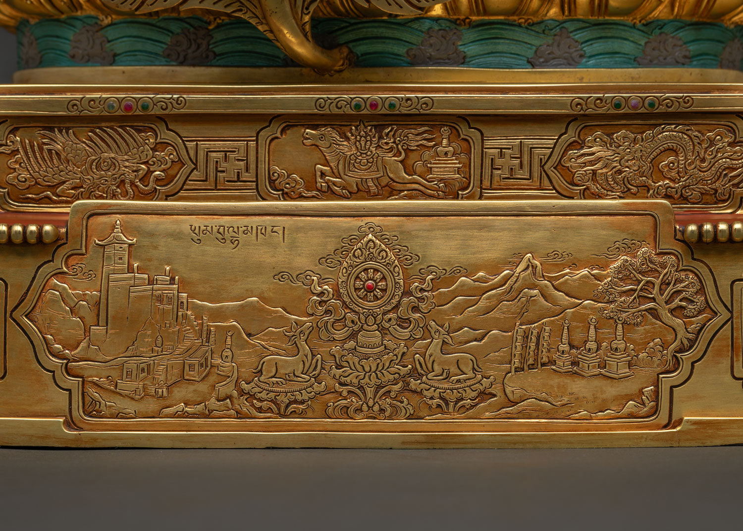 Mountains and stupas relief carved into Dzambhala Statue's throne base
