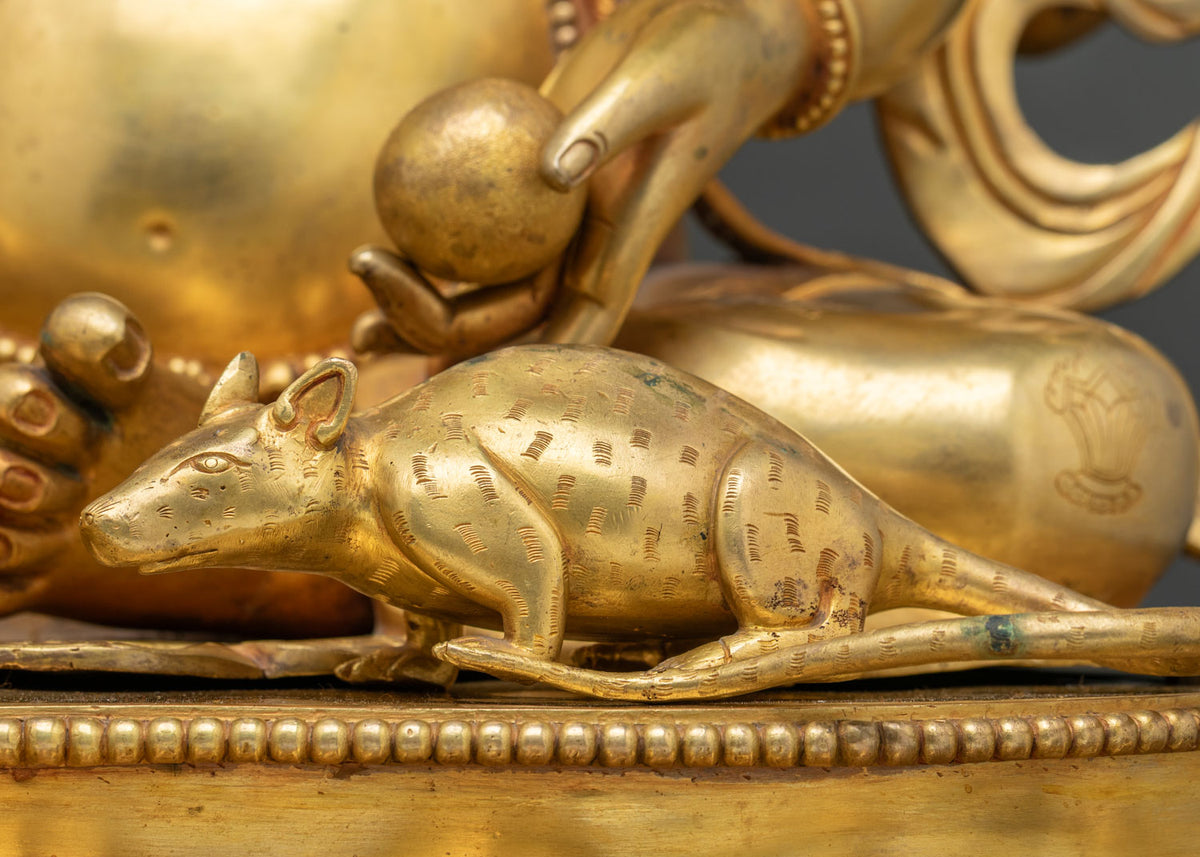 Mushika, Ganesh’s mouse vehicle, finely engraved in gold fire-gilded copper at the statue’s feet