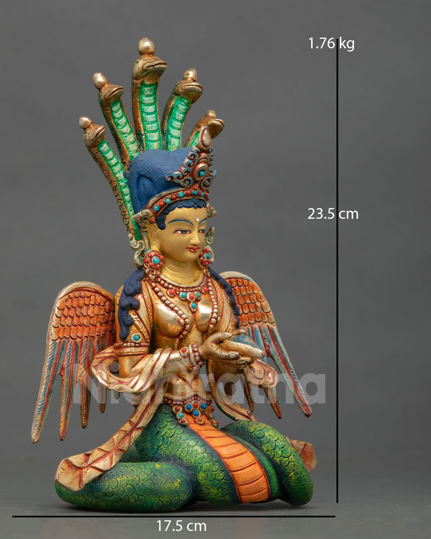naga kanya statue right side view, wings on upper gold gilded body visible with conch shell held in sacred posture