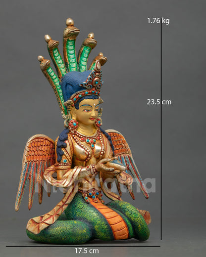 naga kanya statue right side view, wings on upper gold gilded body visible with conch shell held in sacred posture