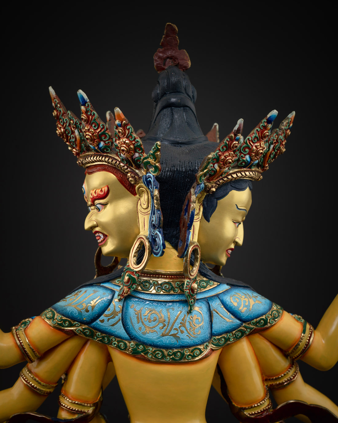 back view of colorful namgyalma statue  with three faces