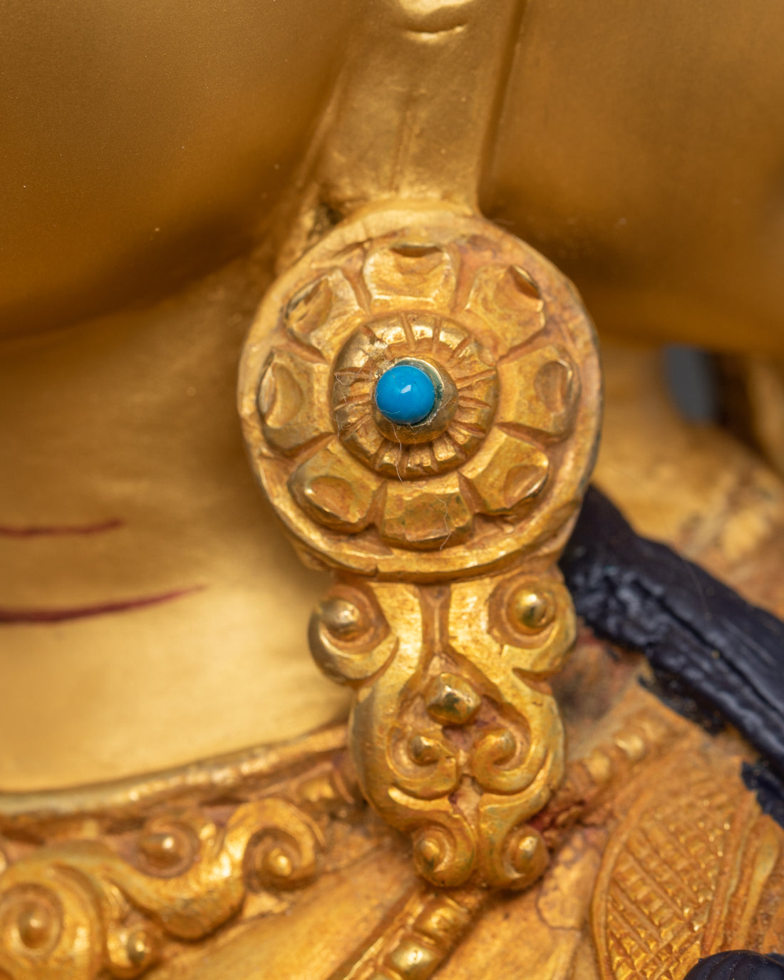 earring of golden namgyalma statue