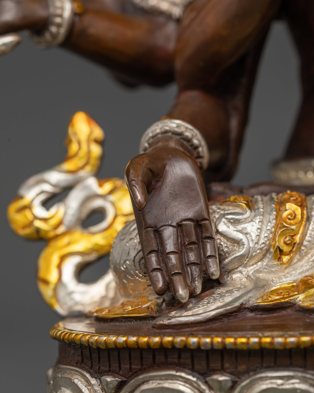 hand of namgyalma statue made of oxidized copper and plated gold