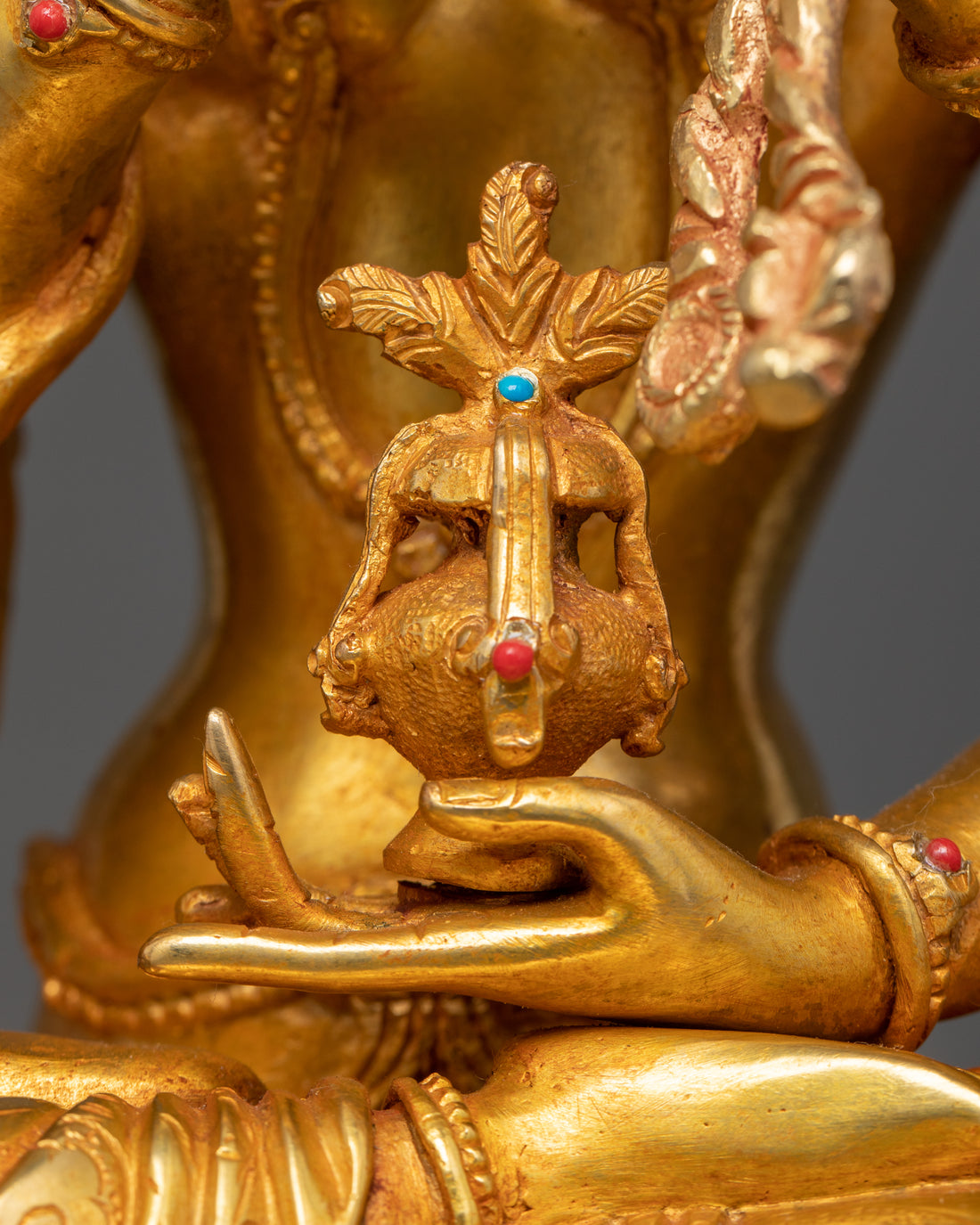 nectar vase held by one of the hands of namgyalma statue