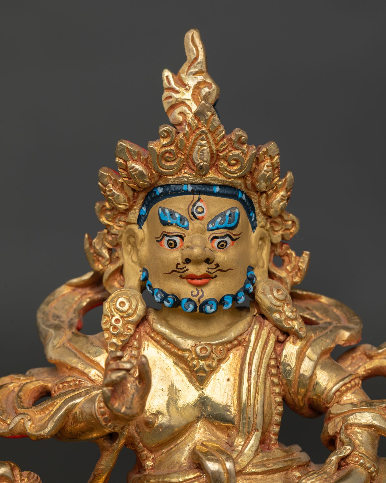 Namtoshe Statue showing Vaishravana’s wrathful guardian face with gold painted details