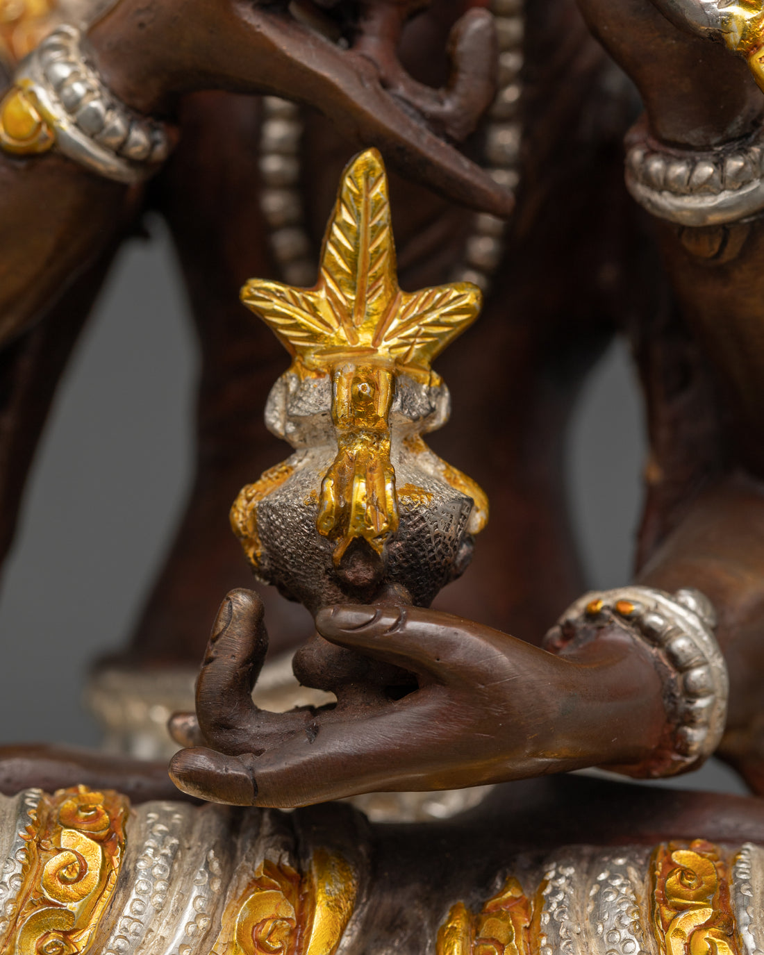 nectar vase being held by namgyalma statue