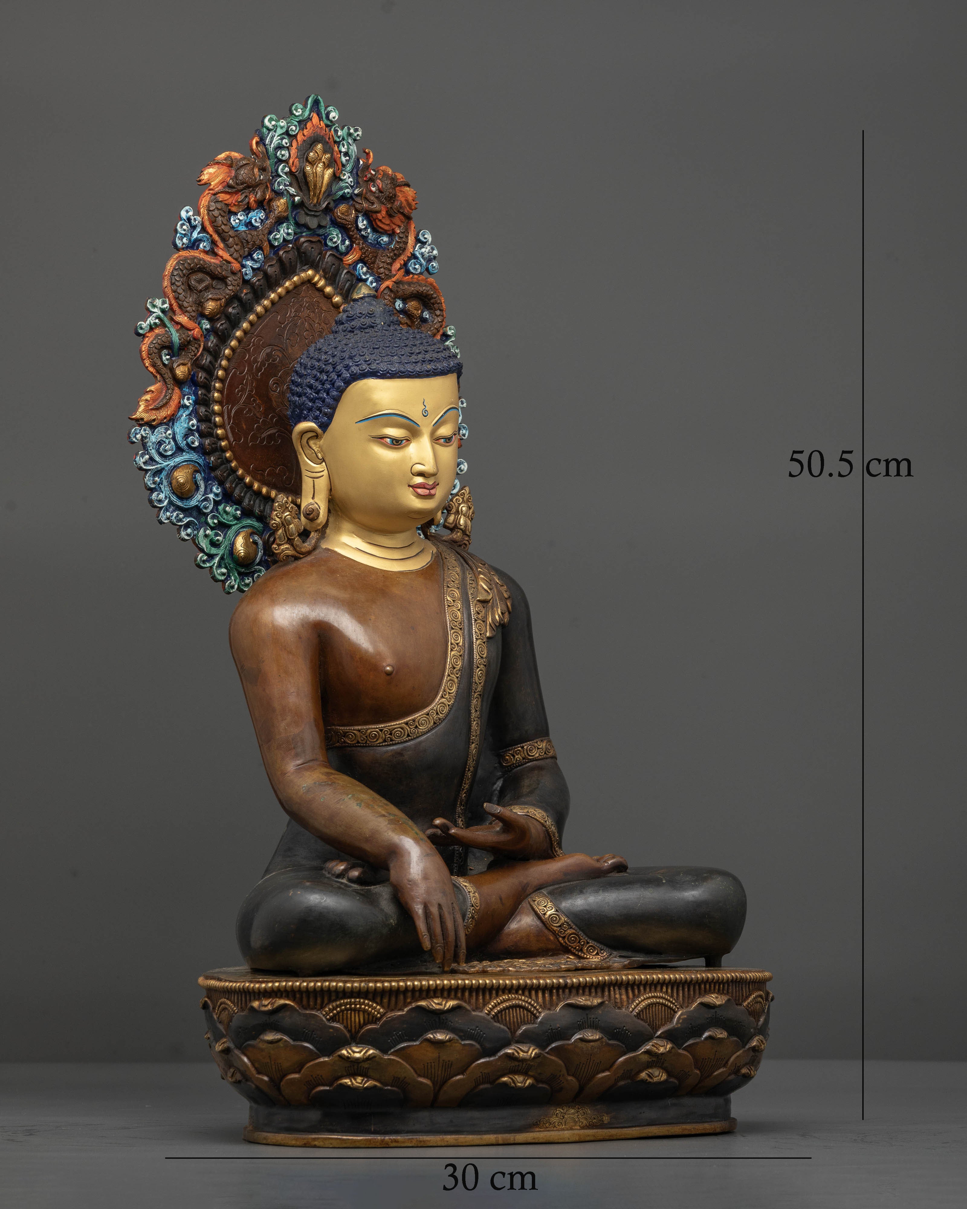 Nepalese Buddha sculpture featuring a carved halo with floral motifs and dragon engravings