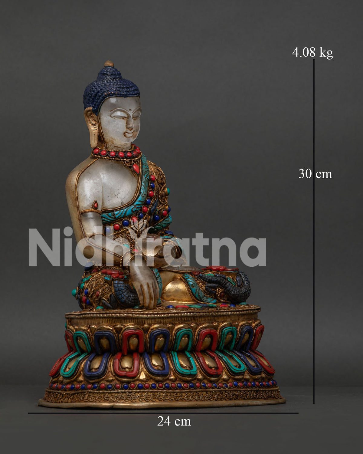 Nepalese Buddha statue seated on double lotus pedestal with earth touching mudra