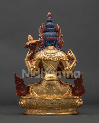 Nepalese Chenrezig statue with floral silk garment celestial scarf and carved lotus pedestal.