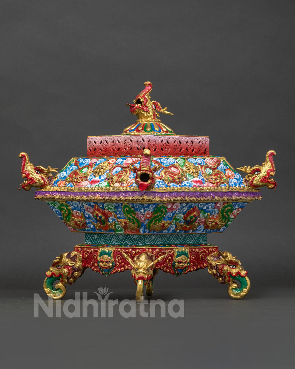 Nepalese copper incense burner with traditional Buddhist carvings and colorful painting
