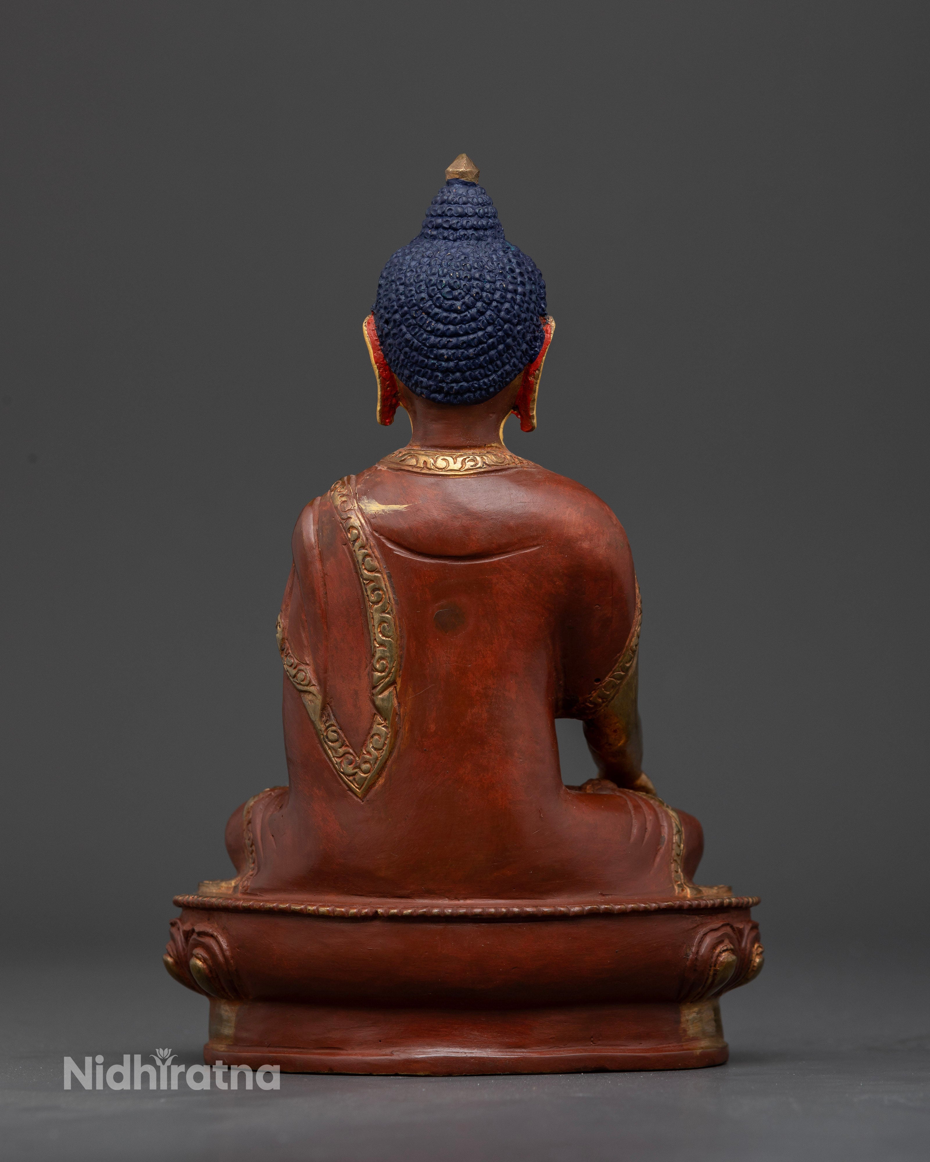 Nepalese copper Shakyamuni buddha seated on lotus throne.