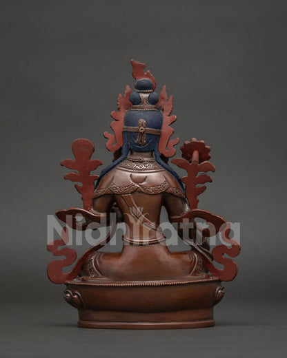 Nepalese Green Tara sculpture in lalitasana posture with richly embellished garments.