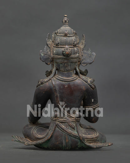 Nepalese Lokeshvara Buddhist statue with oxidized copper finish for meditation altar.