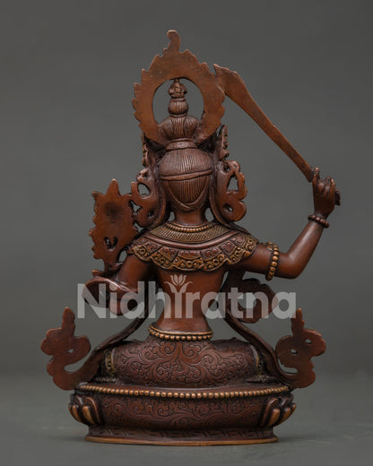 Nepalese Manjushri Statue with hand-carved floral motifs.