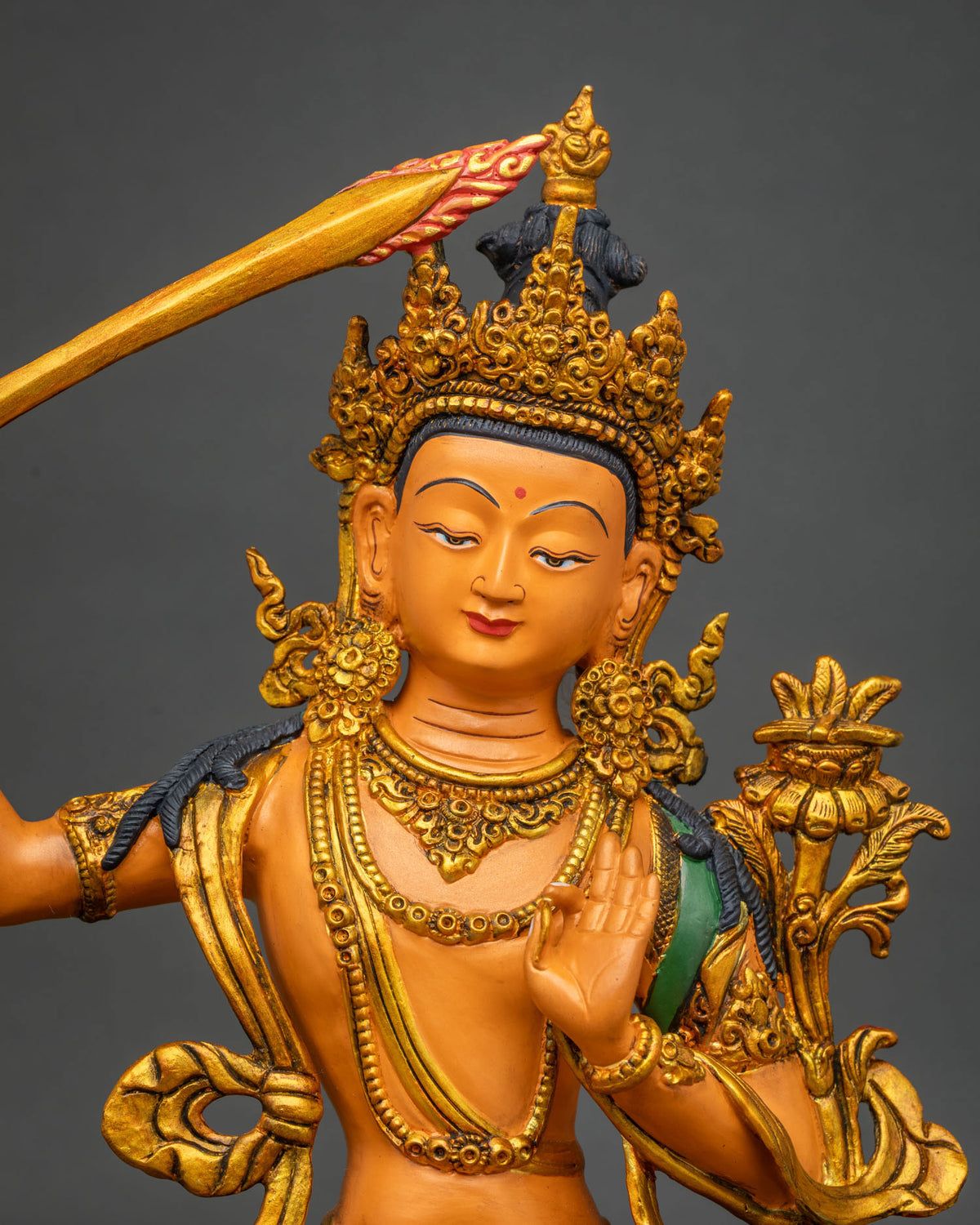 Nepalese Manjushri Statue left side view with utpala lotus and hand painted acrylic details
