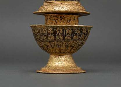 nepalese neshi rice pot with hand-carved cloud motifs and gold detailing
