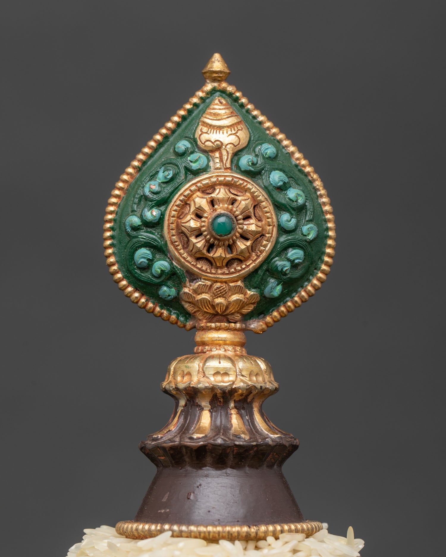 Nepalese offering mandala with sacred Buddhist figures and Norbu finial.