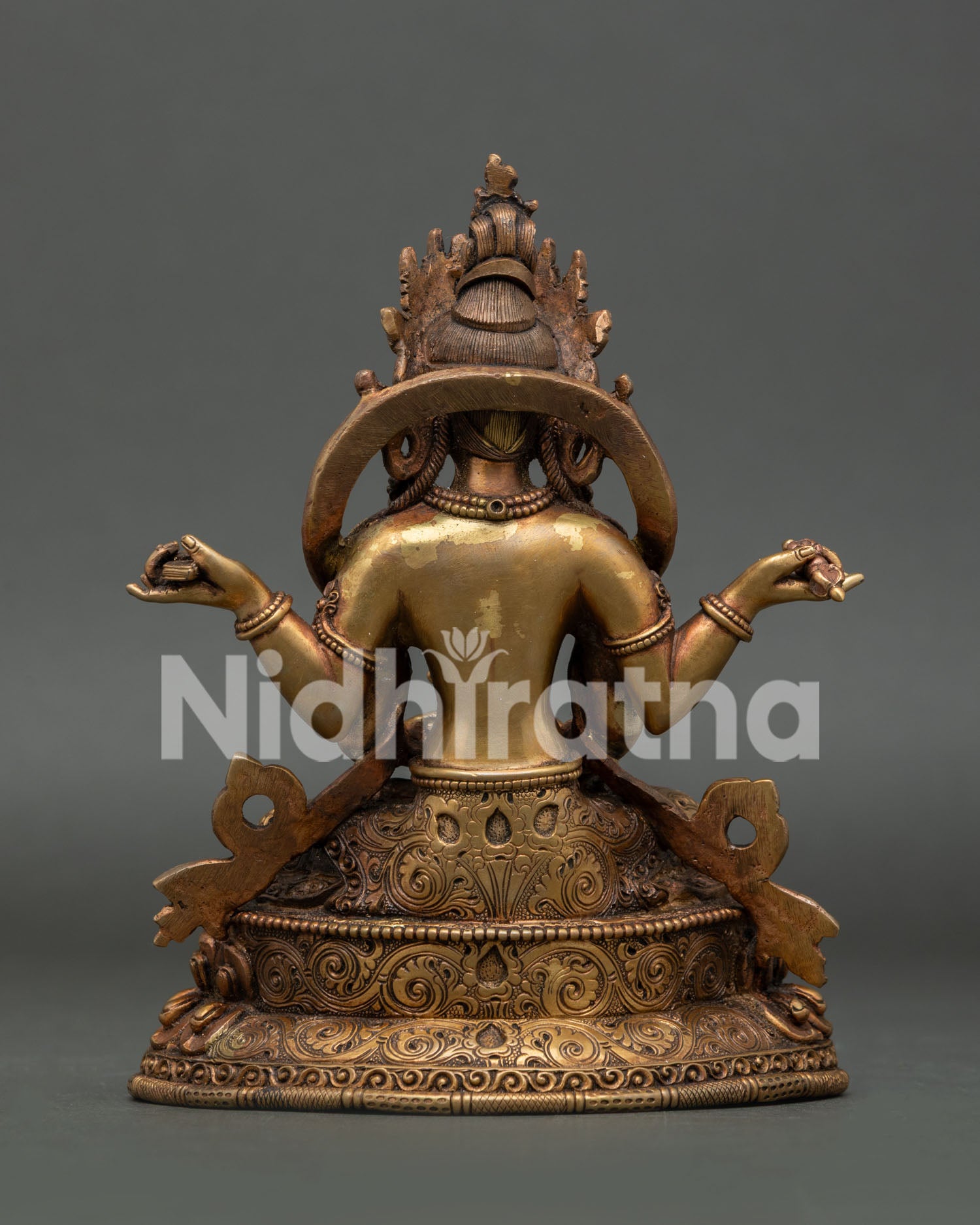 Nepalese Prajnaparamita statue with intricate robe and floral garment.