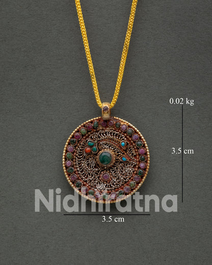 Nepalese spiritual locket featuring floral filigree artwork and semi precious gemstones