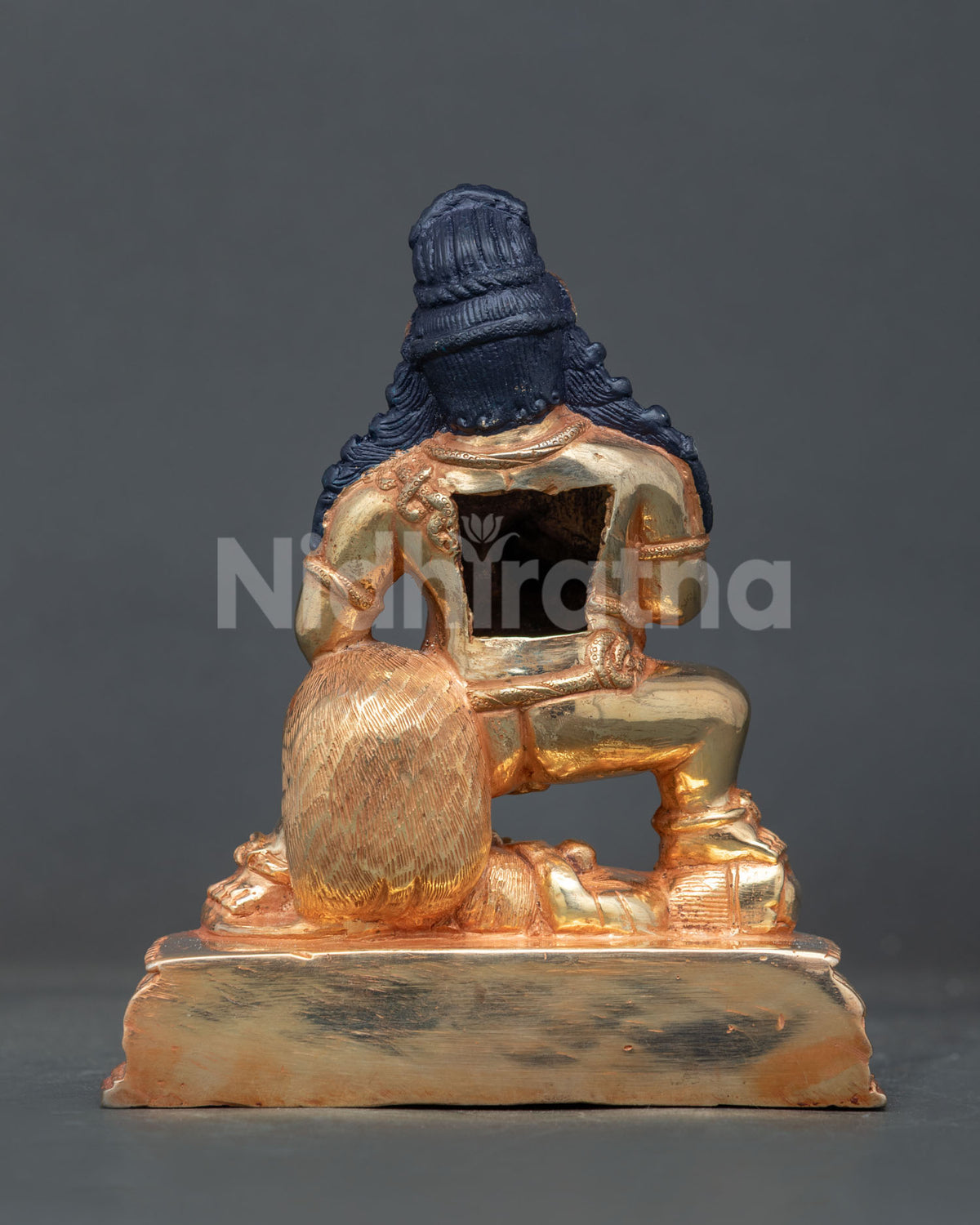 Nepali black dzambhala statue with gold fire gilding for buddhist altar shrine and sacred space.