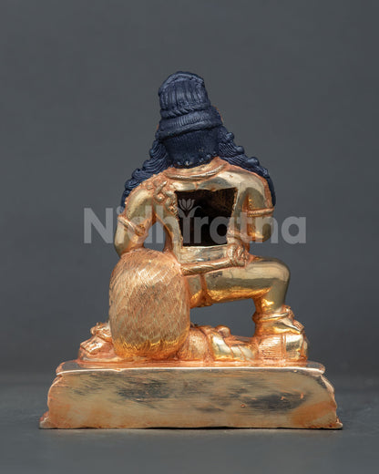 Nepali black dzambhala statue with gold fire gilding for buddhist altar shrine and sacred space.