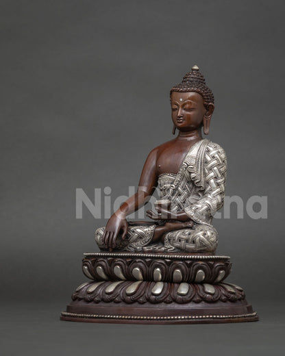 Nepali shakyamuni buddha statue with hand carved lotus pedestal and silver plated monk robe.