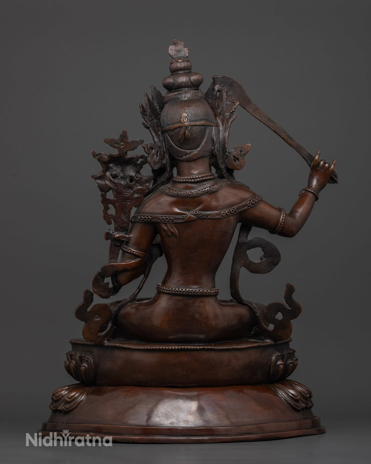 Newari crafted Manjushri statue featuring intricate copper details for a Buddhist altar, meditation room, or sacred shrine.