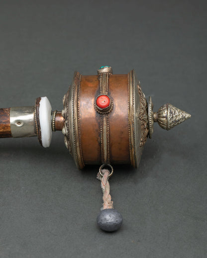 Newari handcrafted buddhist prayer wheel with oxidized silver plating and chain.