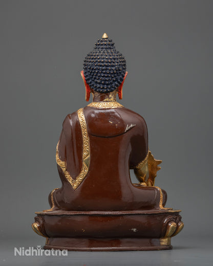 Newari handcrafted Medicine Buddha statue from Patan Nepal showcasing traditional metalworking artistry.