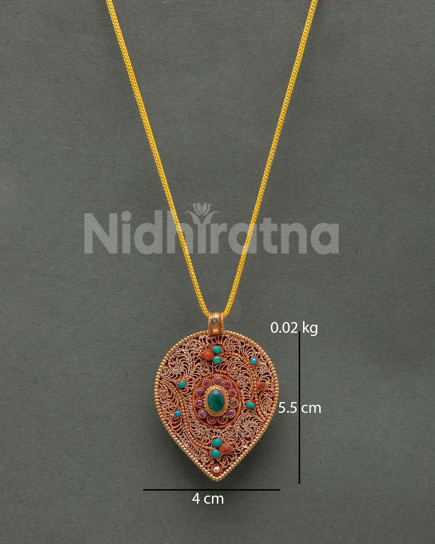 Newari Leaf Locket featuring intricate gold-plated filigree and semi-precious stone accents