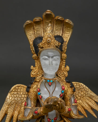 Newari Naga Kanya deity holding sacred conch shell with intricate gold craftsmanship
