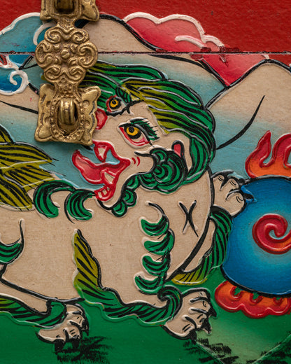 Ornate sacred storage box with snow lions and traditional Himalayan artwork