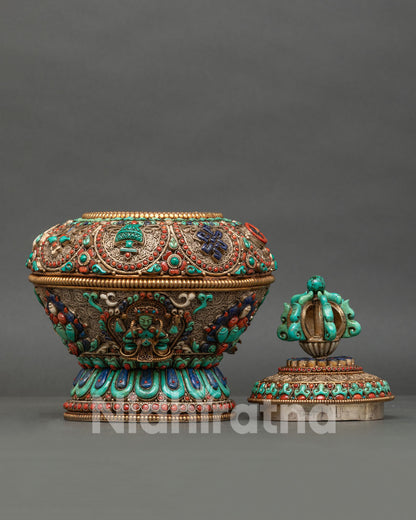 Ornate turquoise finial on Tibetan ritual rice pot lid