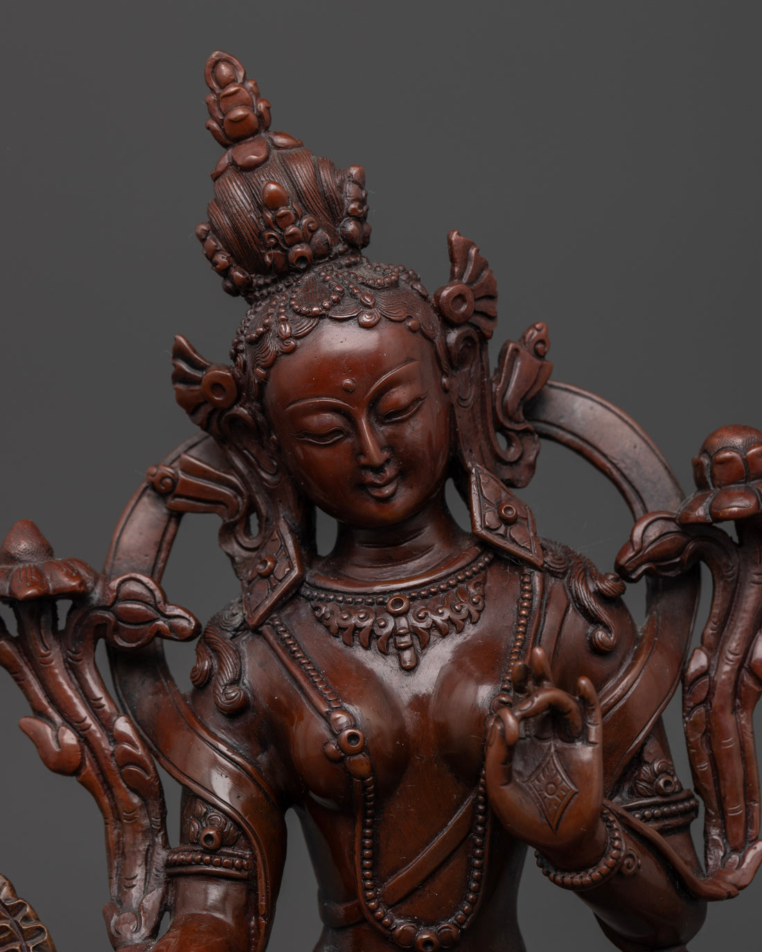 face of delicately handcrafted copper white tara statue