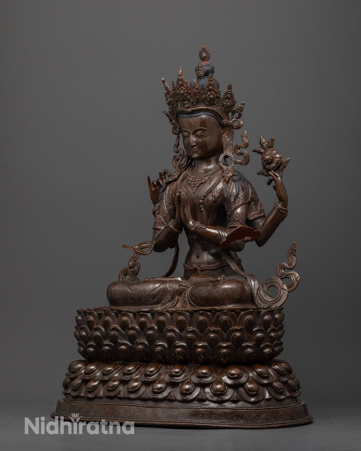 Oxidized Chenrezig Buddhist statue featuring intricate ornamental carvings, serene facial expression, and finely sculpted jewelry