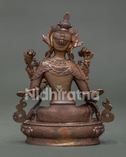 Oxidized copper Green Tara Statue with traditional details for meditation room and sacred shrine.